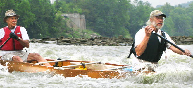 Mike and Bernie race over rapids down the Great Miami River